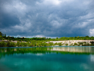 Karlstrup Kalkgrav in Solrød, Denmark—former limestone quarry with turquoise waters, lush...