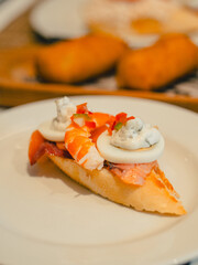 Pintxo with shrimp, egg, and creamy topping on baguette in San Sebastián, Spain—an irresistible bite of Basque cuisine, perfect for food lovers and culinary travelers.