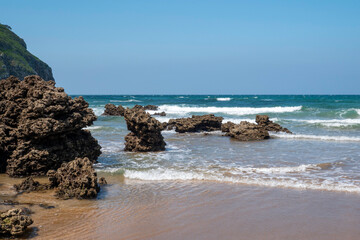 the beautiful Atlantic or Cantabrian coast of Spain with beautiful rock formations on the beach
