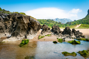 the beautiful Atlantic or Cantabrian coast of Spain with beautiful rock formations on the beach