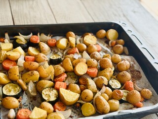Roasted Vegetables Just Out of the Oven – Potatoes, Carrots, Zucchini, Onion and Garlic with...