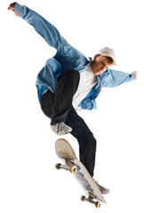 Young man in denim jacket executes dynamic skateboard trick mid-air with fierce focus, on...