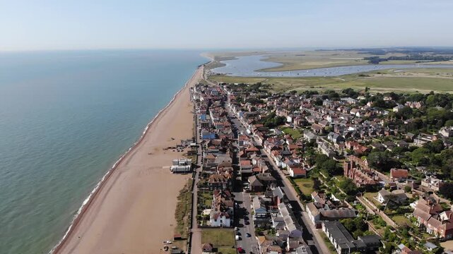 Revealing drone shot showing the sea front at Aldeburgh, Suffolk, UK. 21.06.25