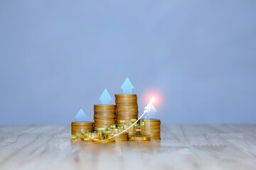 Stacks of gold coins with upward arrows and a rising graph, symbolizing strong financial growth, successful investments, and increasing profits.