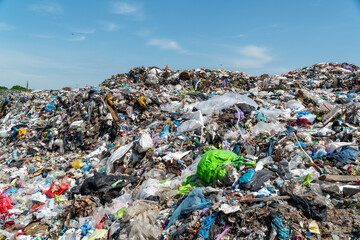 Massive accumulation of waste and plastic waste fills the landfill area, creating an overwhelming...