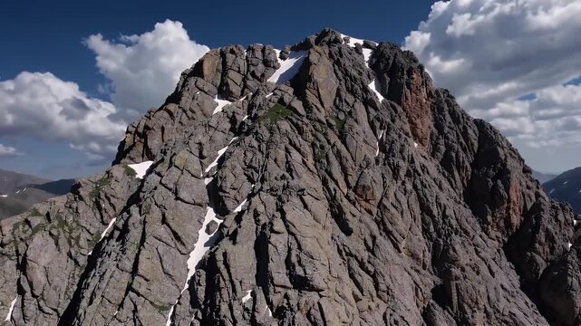 wide scenic view of backpackers traversing evening sun reflects off snowcapped summits showing mountain range in all its majestic summer glory near Silverton