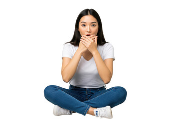 Surprised young asian woman sitting crosslegged with hands over her mouth isolated on transparent background