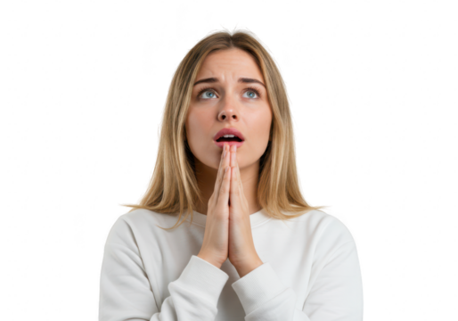 A young woman with hands clasped in prayer looks upwards with a hopeful expression isolated on transparent background