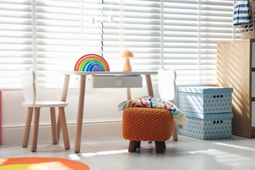 Stylish playroom with toys and furniture. Interior design