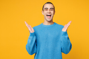Young shocked surprised overjoyed middle eastern man he wearing blue sweatshirt casual clothes look...