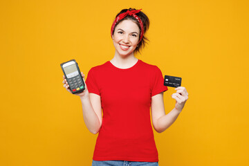 Young fun woman she wearing red t-shirt casual clothes hold wireless modern bank payment terminal...