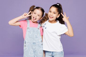 Little smiling cheerful two friends kids children girls 9-10 years old wear casual clothes together...