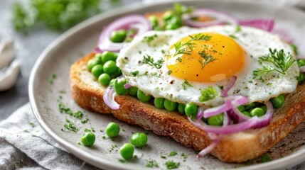 Healthy breakfast composition with fried egg, green peas on toast,