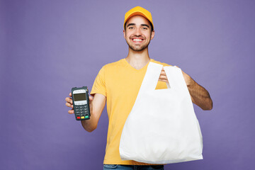 Young delivery guy employee man wear yellow cap t-shirt uniform workwear work as dealer courier...