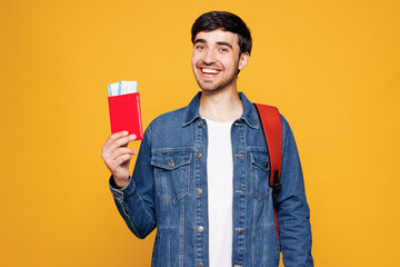 Young tourist traveler boy student wear denim casual clothes backpack bag hold passport ticket...