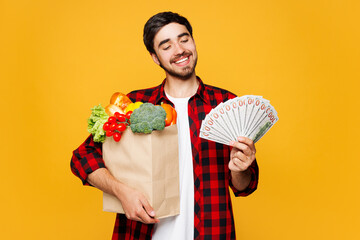 Young man wear casual clothes hold craft bag for takeaway mock up with food products, fan cash...