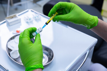 Healthcare Professional Preparing Vaccine Injection in a Clinical Setting with Sterile Equipment...