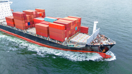 front of cargo ship carrying container and running for export goods from cargo yard port to custom...
