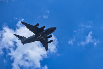 Jet soaring through the clear blue sky.