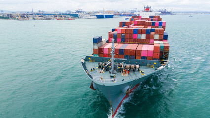 Front Cargo Container ship the ocean ship carrying container and running for import export concept...