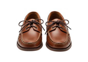A pair of classic brown leather boat shoes with laces, isolated on a transparent background