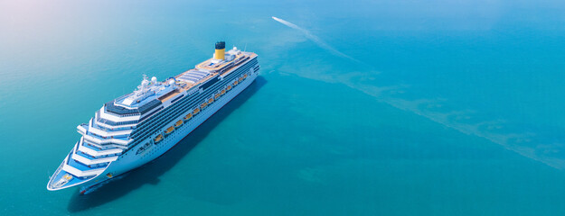 Aerial view of beautiful white cruise ship above luxury cruise in the ocean sea at early in the...