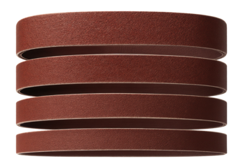 Garnet sanding belts in multiple grits for a belt sander in a carpentry workshop.