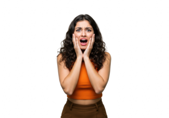 A young woman with curly hair expresses shock and fear, holding her hands to her face with her mouth open, isolated on a transparent background