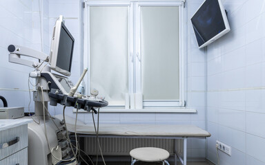 Clean and Modern Ultrasound Room Featuring Advanced Medical Equipment for Diagnostic Imaging and Patient Examination in a Bright Clinical Setting