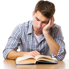 An exhausted male student is sitting reading a book