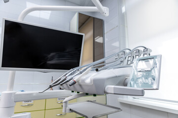 Modern Dental Clinic Equipment Featuring an Advanced Dental Chair and Monitor for Enhanced Patient Experience and Efficient Dental Procedures in a Sleek Environment