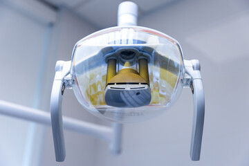 Detailed View of a Modern Dental Lamp with Reflective Surface, Highlighting its Design and...