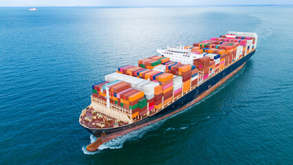 Front Cargo Container ship the ocean ship carrying container and running for import export concept...