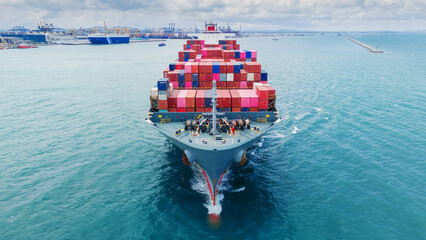 Front Cargo Container ship the ocean ship carrying container and running for import export concept...