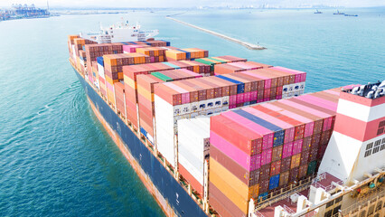 Side Cargo Container ship the ocean ship carrying container and running for import export concept...