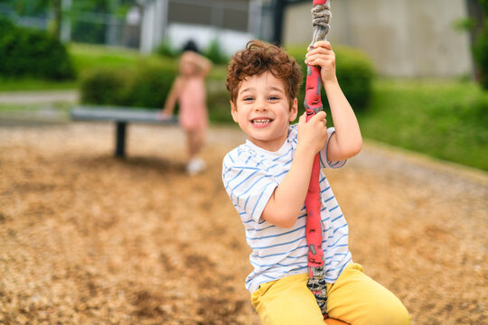 Happy 5 years old girl on a playground