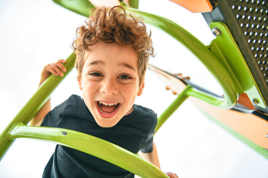 Happy kid on playground on summer season