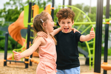 Obraz premium Happy kids on playground in summer season