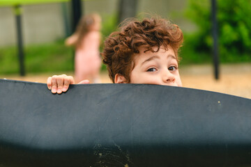 Happy kid on playground on summer season