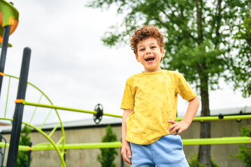 Happy kid on playground on summer season