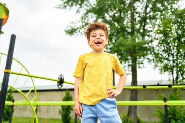 Happy kid on playground on summer season