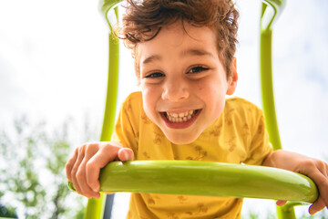 Happy kid on playground on summer season