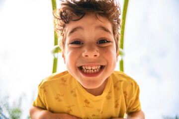 Happy kid on playground on summer season