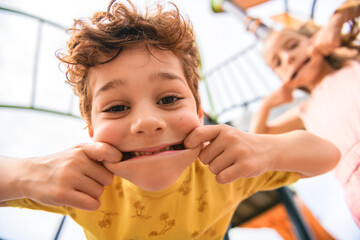 Happy kids on playground in summer season