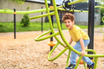 Happy kid on playground on summer season