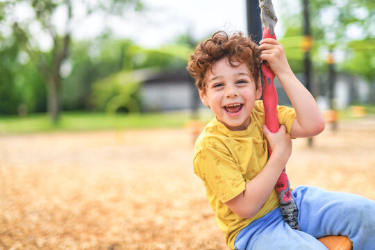 Happy 5 years old boy on a playground