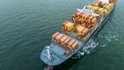 front of cargo ship carrying container and running for export goods from cargo yard port to custom...