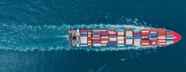front of cargo ship carrying container and running for export goods from cargo yard port to custom...