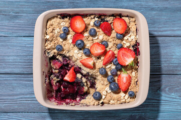 apple blueberry strawberry crumble in baking dish