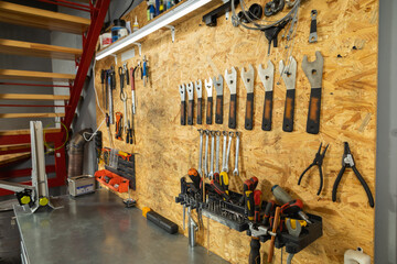 Mechanic workshop contains professional tools for bicycle repair